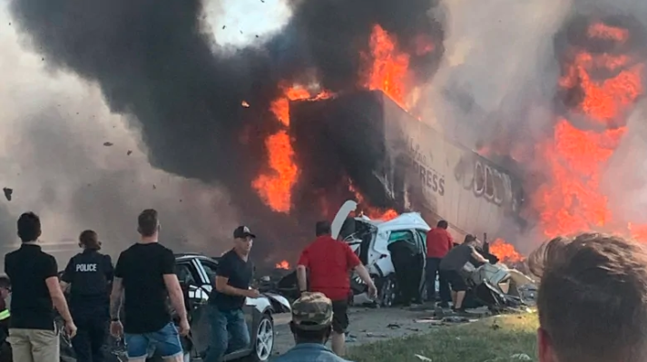 Four people are dead and 12 others injured after a small car got stuck underneath a semi-trailer, causing a major accident Monday afternoon on Highway 440 in Laval, Que., about 27 kilometres north of Montreal.