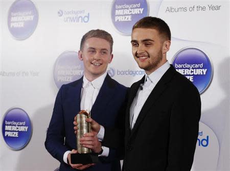 Musicians Howard (L) and Guy Lawrence of the British electronic band Disclosure, nominated for the Mercury Music Prize, poses for a photograph ahead of the ceremony in north London, October 30, 2013. REUTERS/Olivia Harris