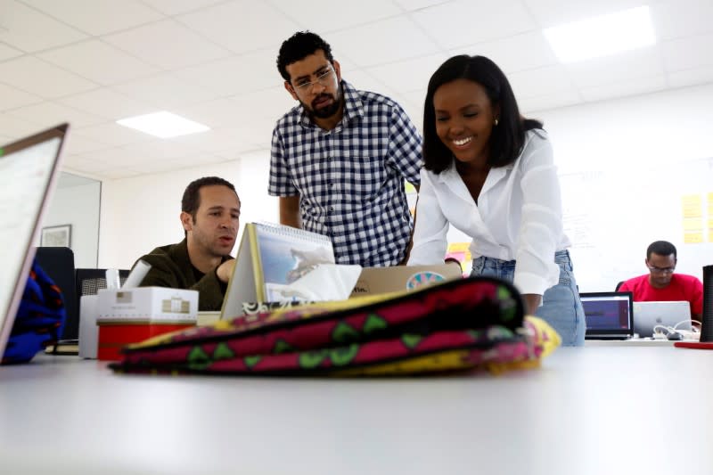 Jihan Abass, founder and CEO of Griffin Insurance, is seen with her colleagues as they prepare to release their flagship digital-only car insurance company