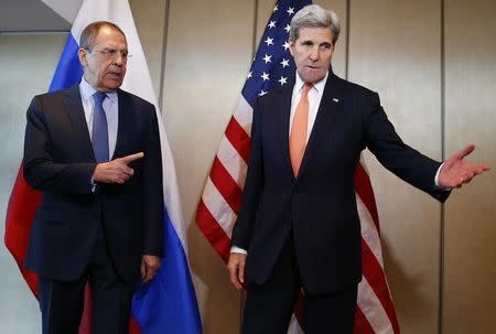 U.S. Foreign Secretary John Kerry and Russian Foreign Minister Sergei Lavrov (L) gesture before their bilateral talks in Munich, Germany, February 11, 2016, ahead of the International Syria Support Group (ISSG) meeting. REUTERS/Michael Dalder