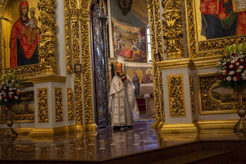 Archimandrite Avraamii, acting vicar of the Kyiv-Pechersk Lavra, conducts an Orthodox Sunday Easter mass inside the Dormition Cathedral at Kyiv-Pechersk monastic complex in Kyiv, Sunday, April 16, 2023. (AP Photo/Bernat Armangue)