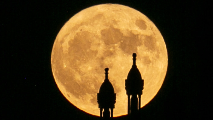 Minarets seen against supermoon in Tunis, Tunisia - Wednesday 13 July 2022