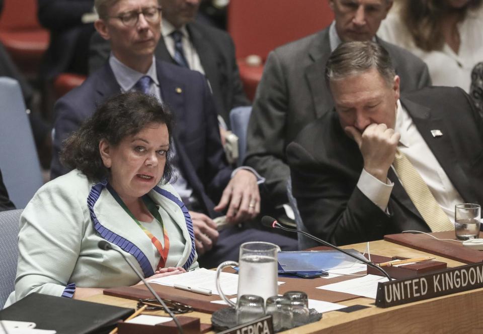 United States Secretary of State Michael Pompeo, right, istens as United Kingdom United Nations Ambassador Karen Pierce, left, address a meeting of the United Nations Security Council on the Mideast, Tuesday, Aug. 20, 2019 at U.N. headquarters. (AP Photo/Bebeto Matthews)