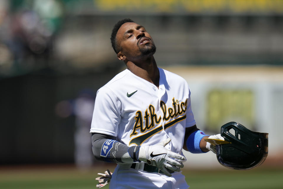 Oakland Athletics' Tony Kemp reacts after flying out with the bases loaded to end the fourth inning of a baseball game against the New York Mets in Oakland, Calif., Saturday, April 15, 2023. (AP Photo/Godofredo A. Vásquez)