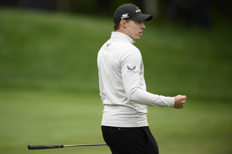 Matt Fitzpatrick, of England, celebrates after making a putt on the 12th hole during the final round of the Wells Fargo Championship golf tournament, Sunday, May 8, 2022, at TPC Potomac at Avenel Farm golf club in Potomac, Md. (AP Photo/Nick Wass)