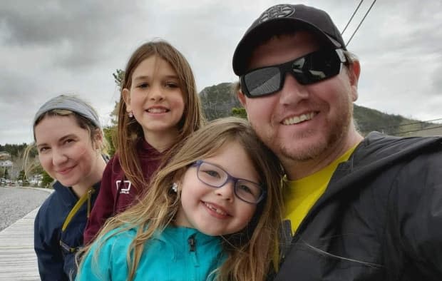 Trent Taylor, right, one of the few people still working aboard the Terra Nova FPSO, is shown with his daughters, Kaylee and Ava. His wife, Amanda Young, left, lost her job last year as a cook on the Terra Nova.