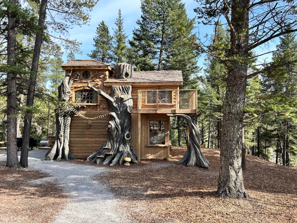 exterior of lost Boys Treehouse, wooden tree cottage in woods