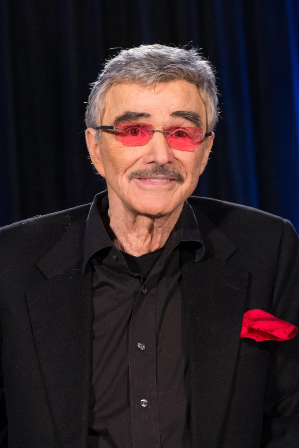 Burt Reynolds smiling for a photo