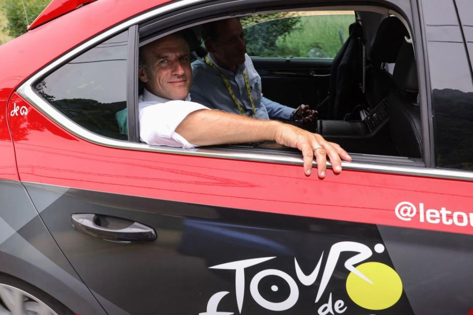 French President Emmanuel Macron rides in the organisation vehicle with Tour the France director Christian Prudhomme on the Col du Tourmalet during the 6th stage of the 110th edition of the Tour de France cycling race 145 km between Tarbes and CauteretsCambasque in the Pyrenees mountains in southwestern France on July 6 2023 Photo by Thomas SAMSON  AFP Photo by THOMAS SAMSONAFP via Getty Images