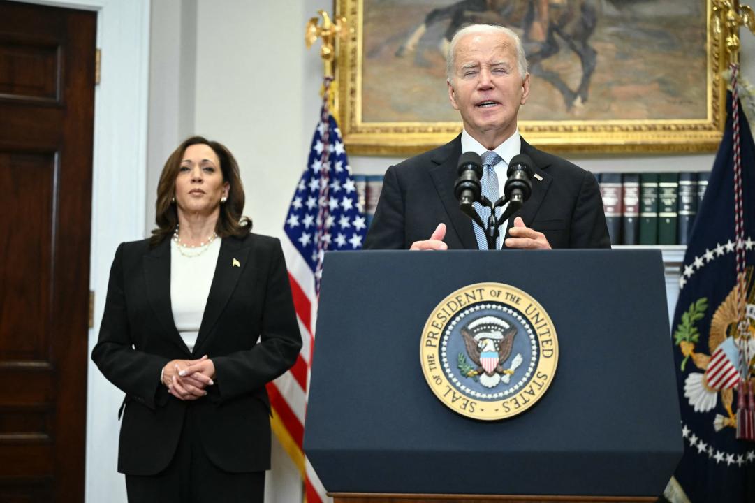 US President Joe Biden speaks from the Roosevelt Room of the White House as Vice President Kamala Harris looks on in Washington, DC, on July 14, 2024, one day after former president Donald Trump survived an apparent assassination attempt during a rally in Pennsylvania. (Photo by Mandel NGAN / AFP) (Photo by MANDEL NGAN/AFP via Getty Images)