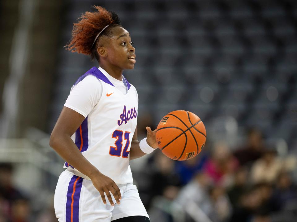 Evansville’s Myia Clark (32) dribbles the ball as the University of Evansville Purple Aces play the Chicago State Cougars at Ford Center in Downtown Evansville, Ind., Wednesday afternoon, Nov. 16, 2022. 