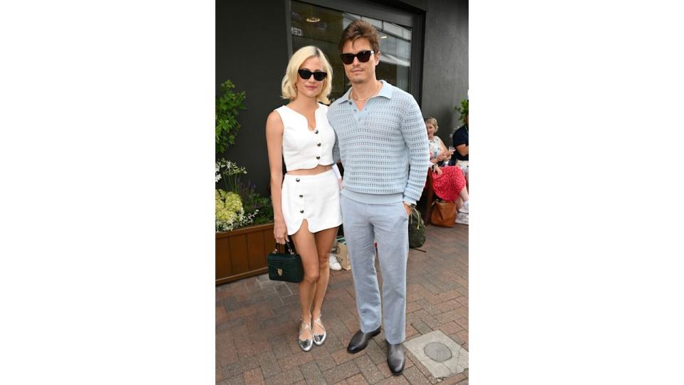 Pixie Lott and Oliver Cheshire attend day one of the Wimbledon Tennis Championships at the All England Lawn Tennis and Croquet Club on July 01, 2024 