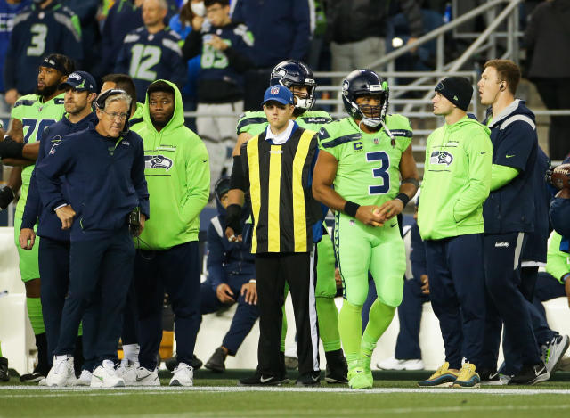 Quarterback (3) Russell Wilson of the Seattle Seahawks puts his hand over  his heart during the National Anthem before playing against the Houston  texans in an NFL football game, Sunday, Dec. 12