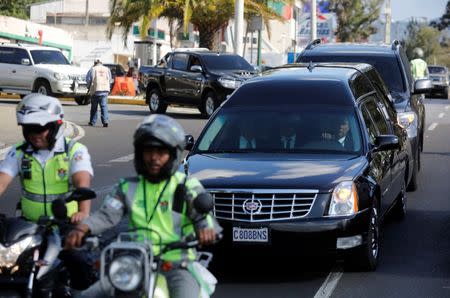 A hearse carrying the coffin of former Guatemalan military dictator Efrain Rios Montt, is pictured during his funeral, in Guatemala City, April 1, 2018. REUTERS/Luis Echeverria