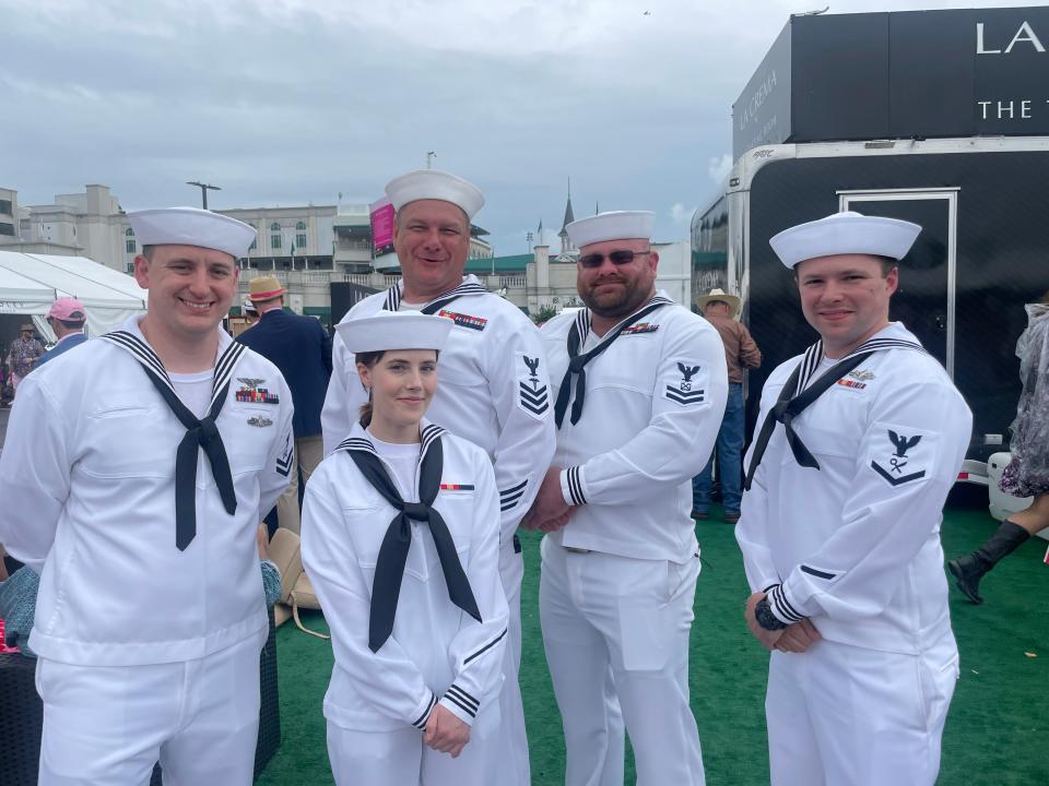 U.S. Navy members Kevin Kays, Raleigh Abbott, Lyle Yeager, Anthony Brown and Lecota Barrientos enjoying Kentucky Oaks after guarding the railings earlier in the day on Friday, May, 3, 2024.