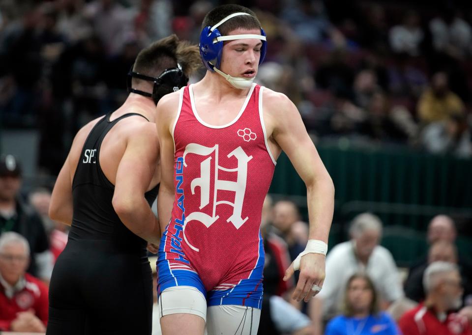 Highland's Cael Gilmore wrestles St. Paris Graham's Brogan Tucker in the 144-pound state final in Division II.