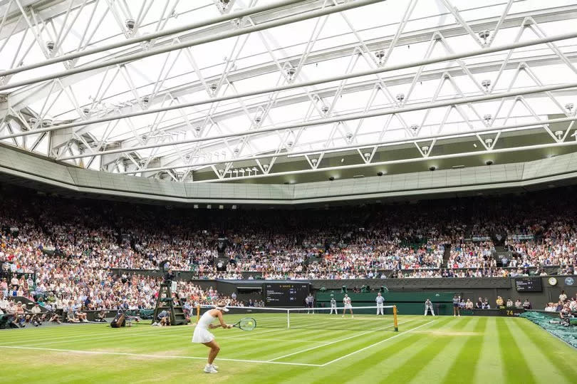 LONDON, ENGLAND - JULY 15: Marketa Vondrousova of the Czech Republic in action with the roof closed during the Women's Singles Final against Ons Jabeur of Tunisia at The Wimbledon Lawn Tennis Championship at the All England Lawn and Tennis Club at Wimbledon on July 15th, 2023 in London, England. (Photo by Simon Bruty/Anychance/Getty Images)