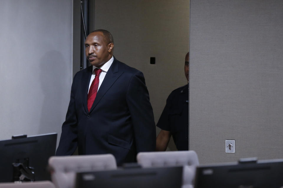 Congolese militia commander Bosco Ntaganda enters the courtroom of the ICC (International Criminal Court) during his trial at the Hague in the Netherlands, Monday July 8, 2019. The ICC is expected to pass judgement Monday on Ntaganda, accused of overseeing the slaughter of civilians by his soldiers in the Democratic Republic of Congo in 2002 and 2003. (Eva Plevier/Pool via AP)