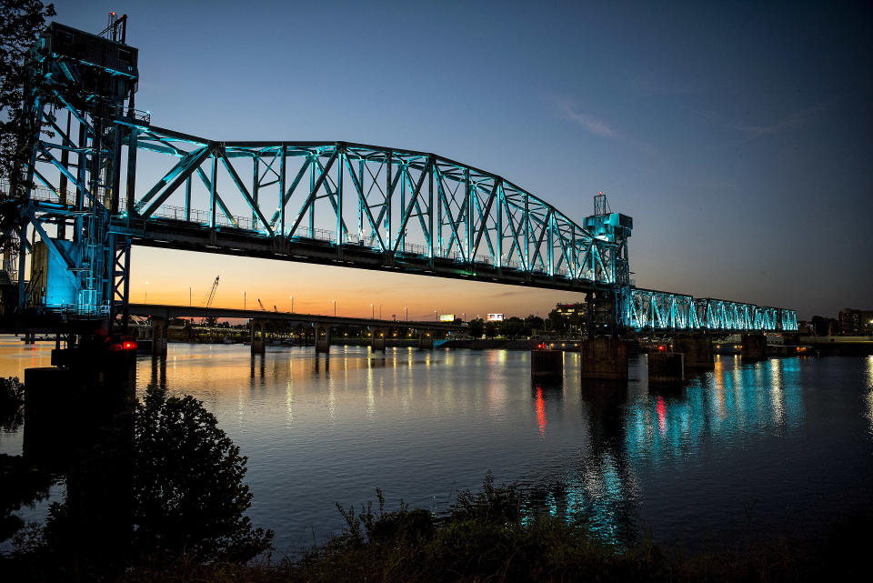 The Junction Bridge illuminated during the evening hours. The bridge changed colors from time to time.