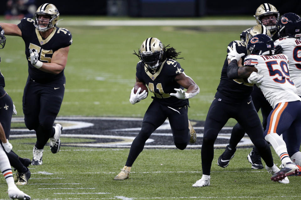 New Orleans Saints running back Alvin Kamara (41) carries in the first half of an NFL wild-card playoff football game against the Chicago Bears in New Orleans, Sunday, Jan. 10, 2021. (AP Photo/Butch Dill)