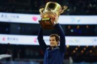 Tennis - China Open men's singles final - Beijing, China - 09/10/16. Britain's Andy Murray holds his trophy after defeating Bulgaria's Grigor Dimitrov. REUTERS/Thomas Peter