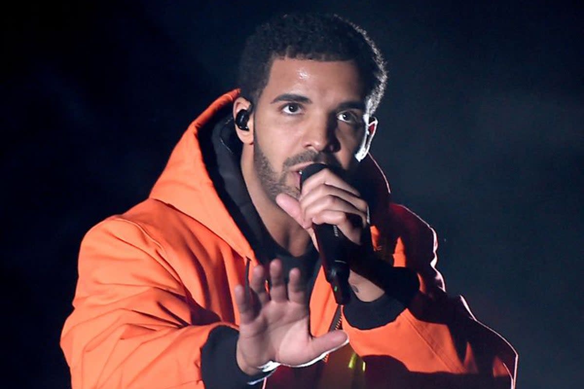 Drake was nearly hit by a phone thrown by a fan on stage during the first night of his It’s All A Blur Tour  (Getty)