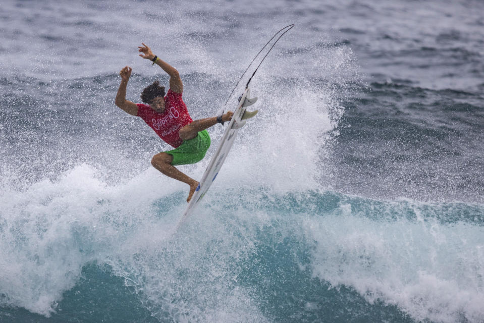 Yago Dora from Brazil competes in the ISA World Surfing Games, a qualifier for the Paris 2024 Olympic Games, off La Marginal beach in Arecibo, Puerto Rico, Wednesday, Feb. 28, 2024. (AP Photo/Alejandro Granadillo)