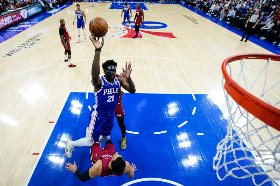 Philadelphia 76ers' Joel Embiid goes up for a shot against Miami Heat's Max Strus during the first half of Game 3 of an NBA basketball second-round playoff series, Friday, May 6, 2022, in Philadelphia. (AP Photo/Matt Slocum)
