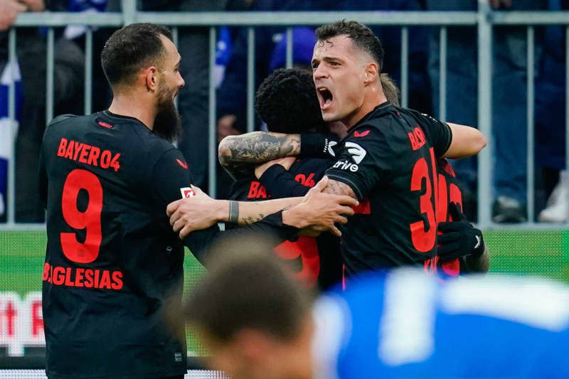 Leverkusen's Granit Xhaka (R) and Borja Iglesias celebrate their first goal during the German Bundesliga soccer match between SV Darmstadt 98 and Bayer Leverkusen at the Merck-Stadion am Boellenfalltor. Uwe Anspach/dpa