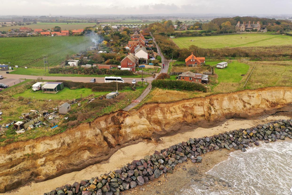 The end of a tarmac road shows the devastation caused by coastal erosion of the cliff face in the village of Happisburgh on November 06, 2019 in Great Yarmouth, England.