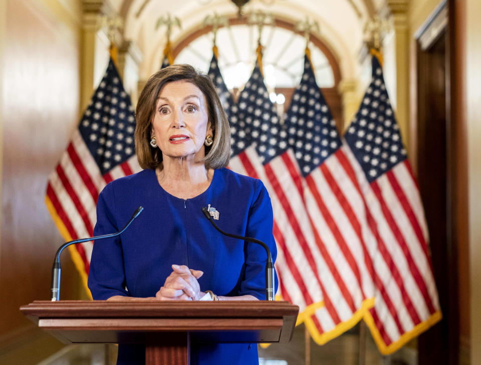 WASHINGTON, DC - September 24: From the Speaker's Balcony hallway, Speaker of the House Nancy Pelosi delivers a speech concerning a formal impeachment inquiry into President Donald Trump on Capitol Hill in Washington, DC on Tuesday September 24, 2019. | The Washington Post—The Washington Post/Getty Images