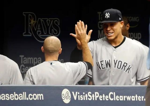 Aaron Judge high fives Ronald Torreyes after hitting his first career grand  slam - pic 1 of 2 in series - Gold Medal Impressions