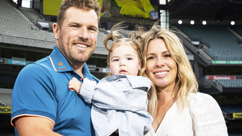 Aaron Finch, pictured here with his wife Amy and daughter Esther.