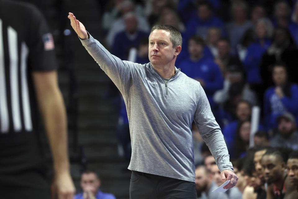 Georgia coach Mike White directs the team during the second half of an NCAA college basketball game against Kentucky on Saturday, Jan. 20, 2024, in Lexington, Ky. (AP Photo/James Crisp)