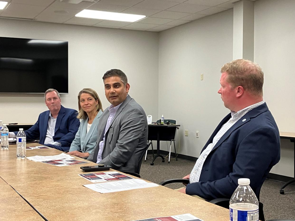 De Pere Mayor James Boyd, from left, TitletownTech managing director Jill Enos, BayCare Clinic CEO Ashwani Bhatia and Manitowoc Mayor Justin Nickels during a Wisconisn Business Leaders for Democracy roundtable Thursday in De Pere.