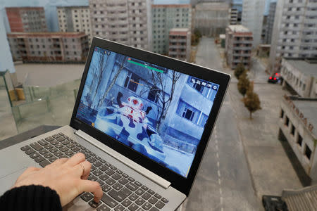 Co-founder of the 'Isotopium: Chernobyl' game Alexey Fateyev shows the game's interface at its location in Brovary, Ukraine April 25, 2019. REUTERS/Valentyn Ogirenko