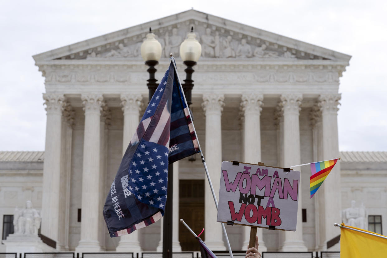 Abortion-rights activists protest outside of the U.S. Supreme Court on Capitol Hill in Washington, Tuesday, June 21, 2022. (AP Photo/Jose Luis Magana)