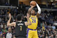 Los Angeles Lakers forward Rui Hachimura (28) shoots against Memphis Grizzlies forward Santi Aldama (7) during the first half of an NBA basketball game Wednesday, March 27, 2024, in Memphis, Tenn. (AP Photo/Brandon Dill)