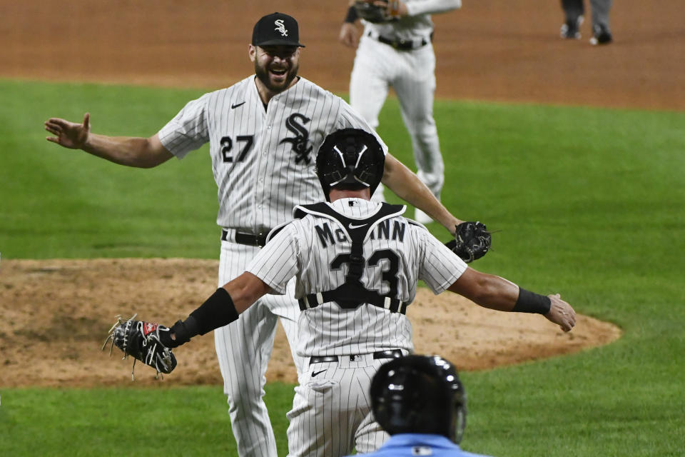 Chicago White Sox starting pitcher Lucas Giolito (27) celebrates with catcher James McCann (33) after closing out a no-hitter in the team's baseball game against the Pittsburgh Pirates, Tuesday, Aug. 25, 2020, in Chicago. The White Sox won 4-0. (AP Photo/Matt Marton)