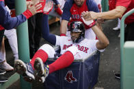 Boston Red Sox's Xander Bogaerts is congratulated for his two-run home run against the Houston Astros during the first inning of a baseball game at Fenway Park, Wednesday, May 18, 2022, in Boston. (AP Photo/Charles Krupa)