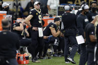 New Orleans Saints quarterback Drew Brees (9) watches from the sideline in the second half of an NFL football game against the San Francisco 49ers in New Orleans, Sunday, Nov. 15, 2020. (AP Photo/Butch Dill)