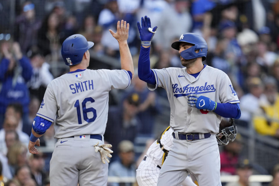 Los Angeles Dodgers' Chris Taylor, right, celebrates with teammate Will Smith after hitting a two-run home run during the fourth inning of a baseball game against the San Diego Padres, Saturday, May 6, 2023, in San Diego. (AP Photo/Gregory Bull)