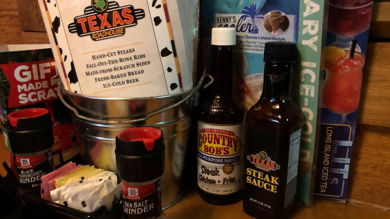 Bottles of Texas Roadhouse steak sauce on a table