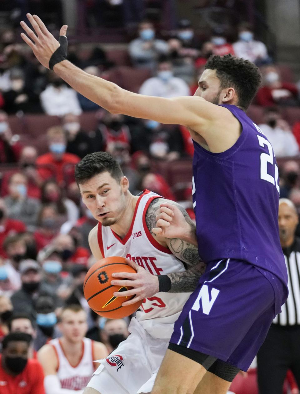 Sun., Jan. 9, 2022; Columbus, Ohio, USA; Ohio State Buckeyes forward Kyle Young (25) drives against Northwestern Wildcats forward Pete Nance (22) during the second half of a NCAA Division I men’s basketball game between the Ohio State Buckeyes and the Northwestern Wildcats at Value City Arena.