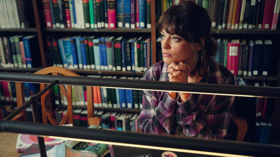 Maeve (Emma Mackey) in the college library in Sex Education season 4