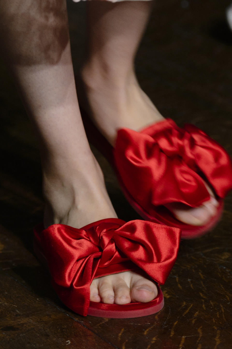 <p><i>Crimson satin bow slides from the SS18 Simone Rocha collection. (Photo: ImaxTree) </i></p>