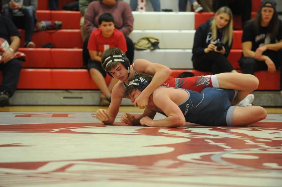 Bellefonte’s Ezra Swisher controls Penns Valley’s Zach Rummel in their 139-pound bout of the Red Raiders’ 51-9 loss on Wednesday at Bellefonte. Swisher pinned Rummel in 1:56.