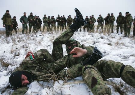 Pro-Russian separatists from the Chechen "Death" battalion take part in a training exercise in the territory controlled by the self-proclaimed Donetsk People's Republic, eastern Ukraine, December 8, 2014. REUTERS/Maxim Shemetov