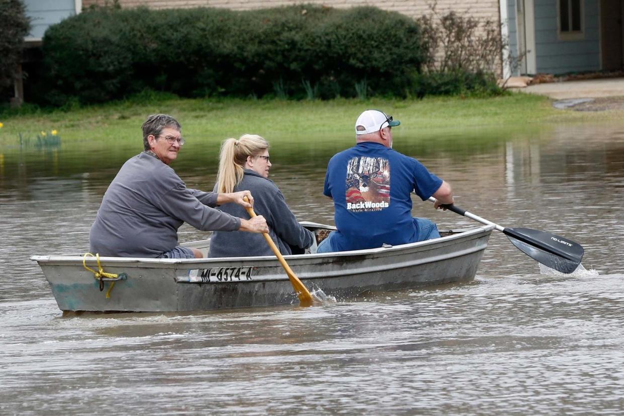 Deluged: residents paddle through Pearl river floodwaters: AP