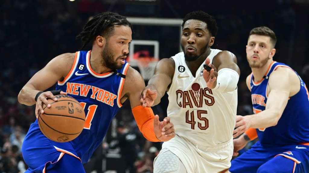 Mar 31, 2023; Cleveland, Ohio, USA; New York Knicks guard Jalen Brunson (11) drives to the basket against Cleveland Cavaliers guard Donovan Mitchell (45) during the first half at Rocket Mortgage FieldHouse.